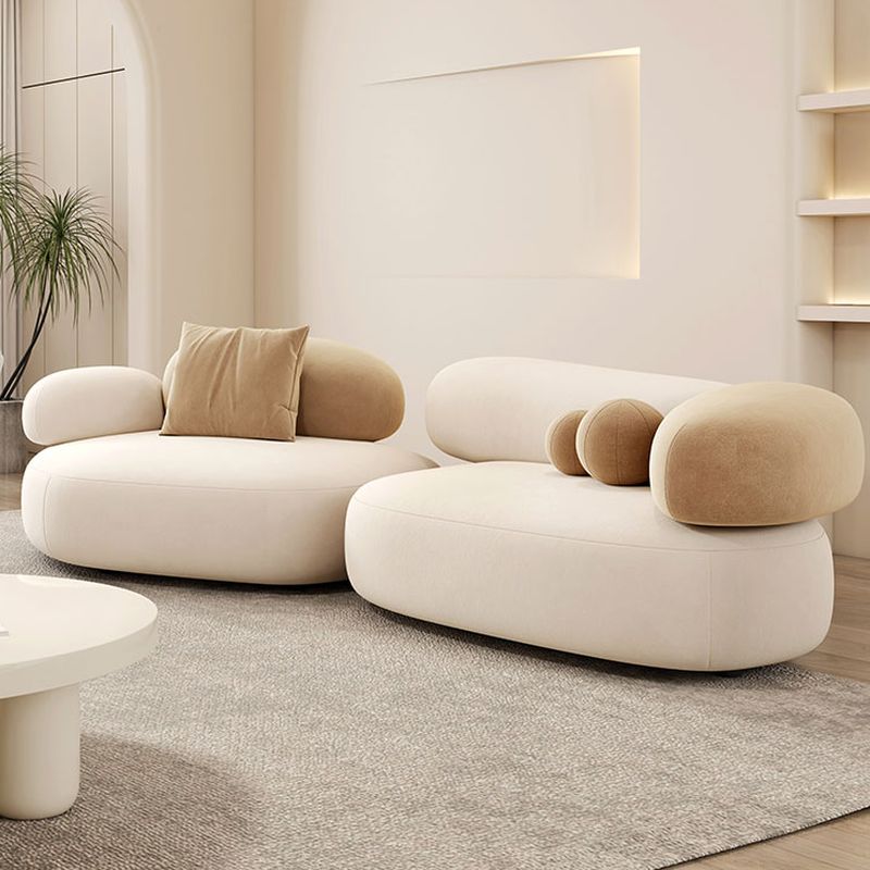 Symmetrical Bow Front Corner Sectional with Round Arm & Concealed Support.