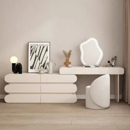 Modern dressing table set with irregular LED mirror, side cabinet, and matching upholstered stool for elegant bedrooms.